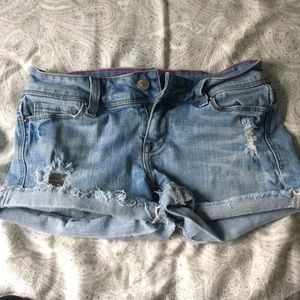 Light wash distressed jean shorts